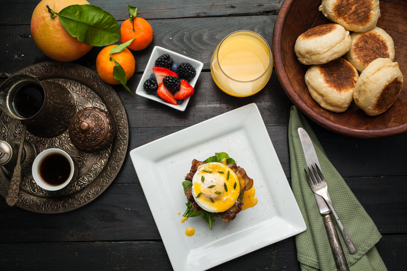 Eggs Benedict with Venison Tenderloin, Pepper Maple Bacon, and Arugula