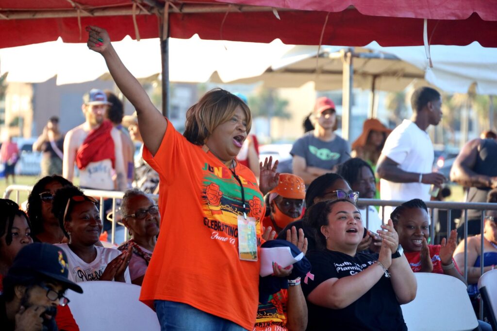A crowd cheers at the annual Juneteenth Festival in Corpus Christi.