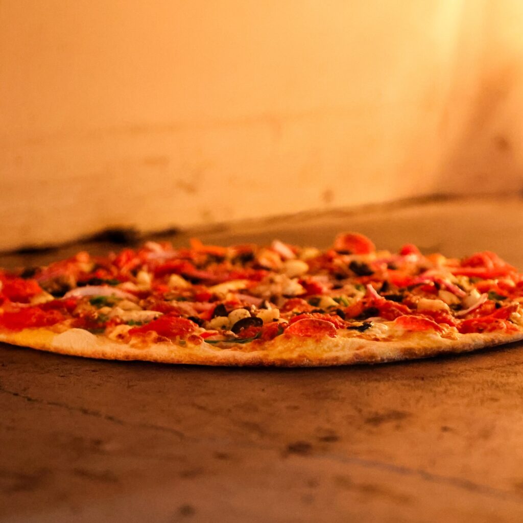 A pizza in the oven. 