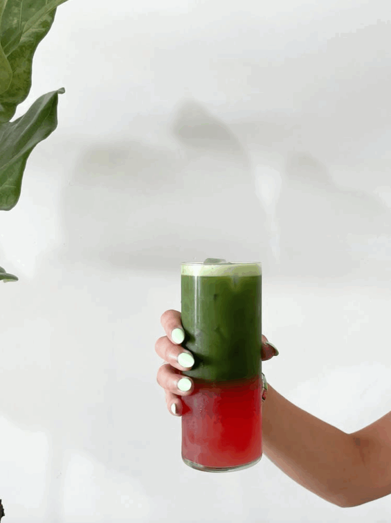 A hand holds the Matcha Melon drink from Fika in Corpus Christi, Texas.