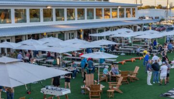 An aerial view of a crowd in the open air venue inside Fifth & Elm.
