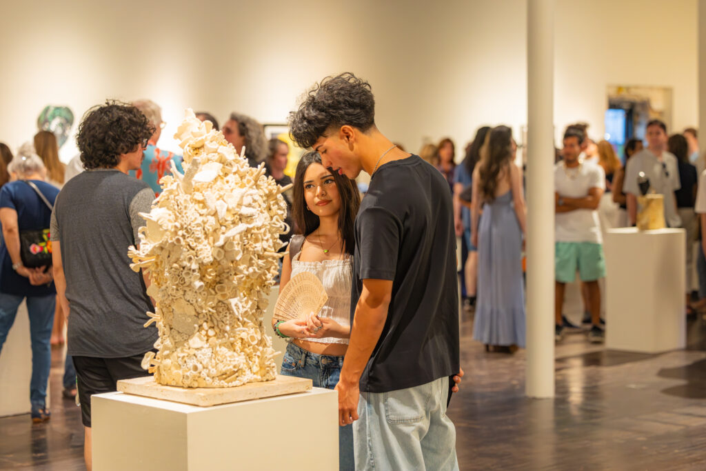 Two individuals looking at a sculpture inside K Space Contemporary in Corpus Christi.